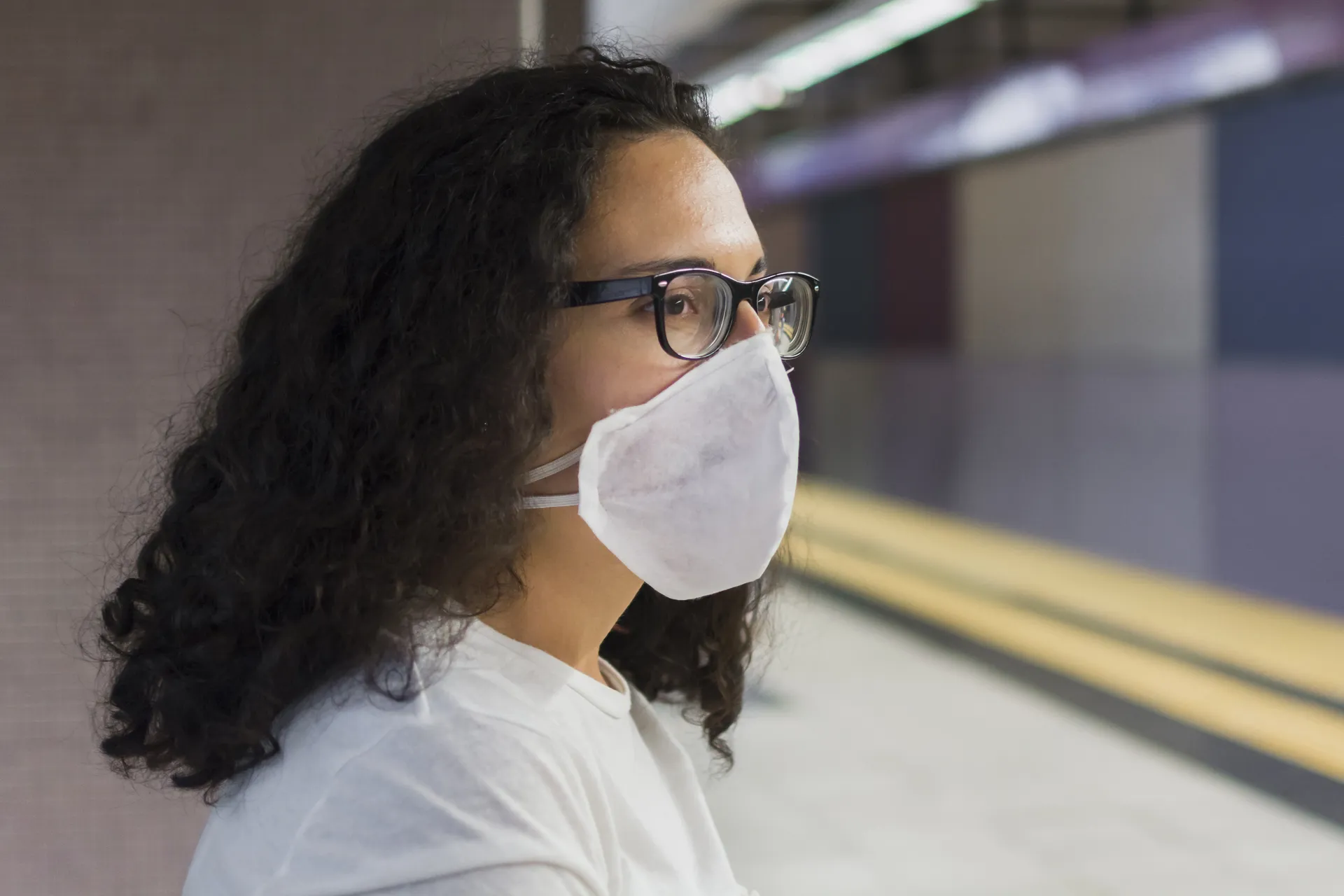 side-view-young-woman-with-medical-mask-waiting